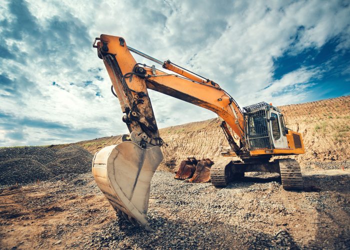Close up details of industrial excavator working on construction site